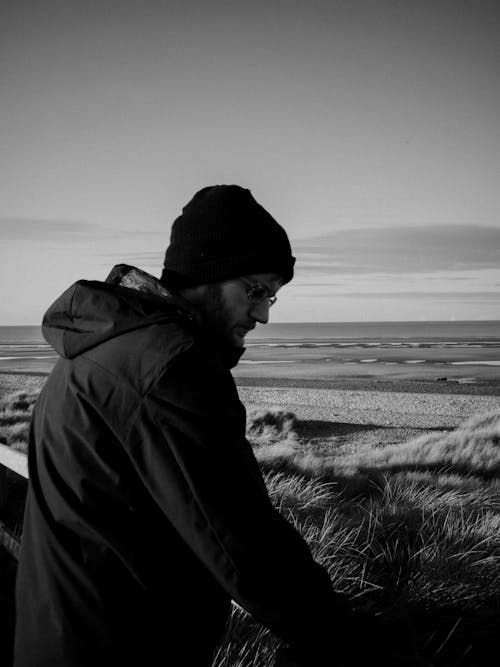 Man in Hat and Jacket in Seaside