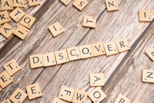 The word discover spelled out in scrabble letters