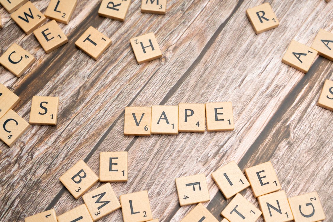The word vape is spelled out in scrabble letters Free Stock Photo The word vape is spelled out in scrabble letters Free Stock Photo