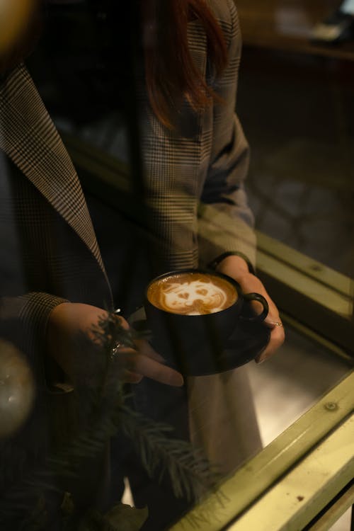 Woman Holding a Cup of Coffee 