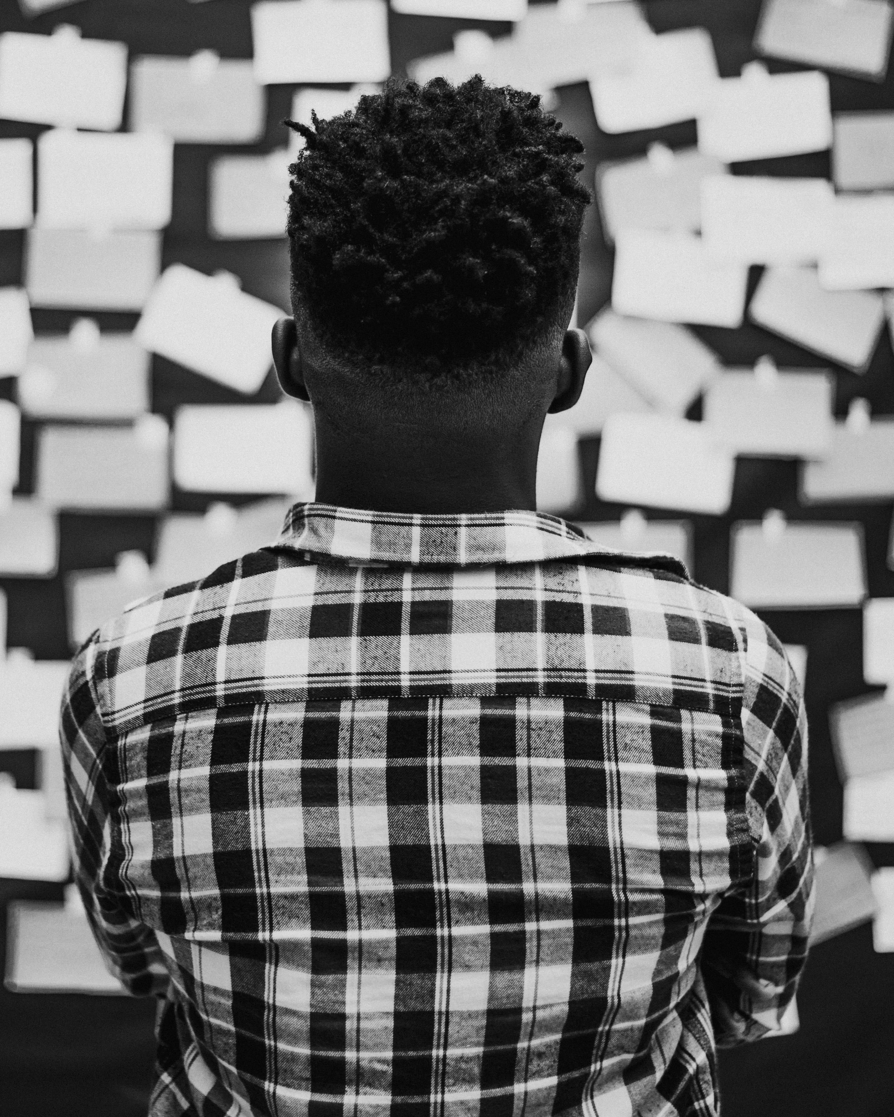 man looking at a bulletin board