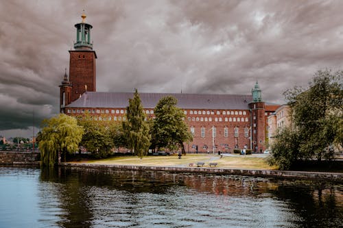 Stockholm City Hall and Lake under and Overcast Sky 