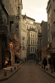 Serene alleyway in Beyoglu, İstanbul showcasing architectural beauty at dusk.