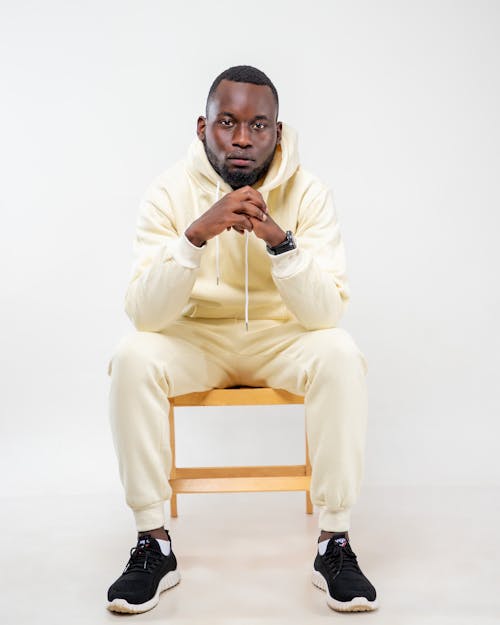 Studio Portrait of a Male Model Wearing a White Hoodie and Sweatpants