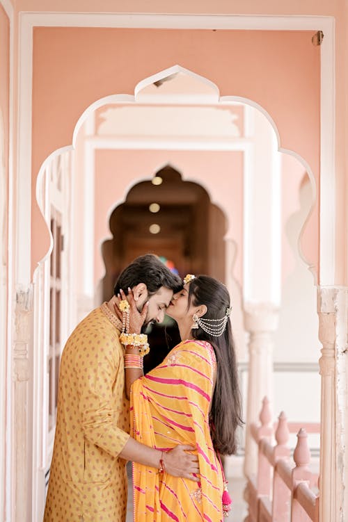 Couple in Traditional Clothes Hugging