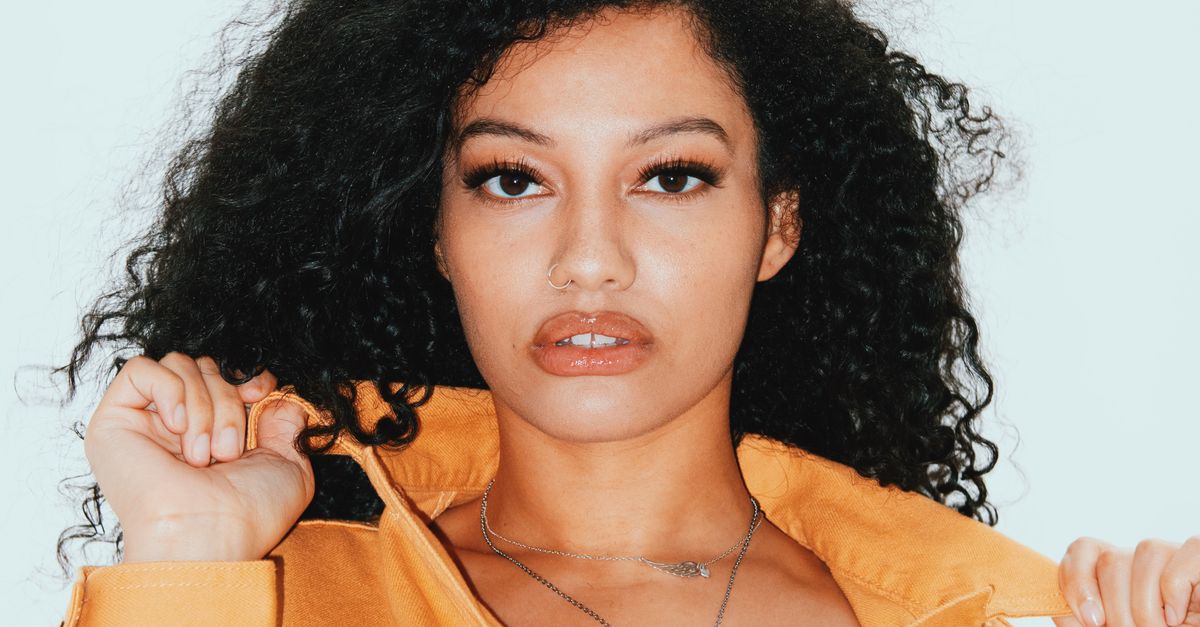 Curly Model Beautiful Curly hair fashion model posing in yellow denim jacket · Free ...