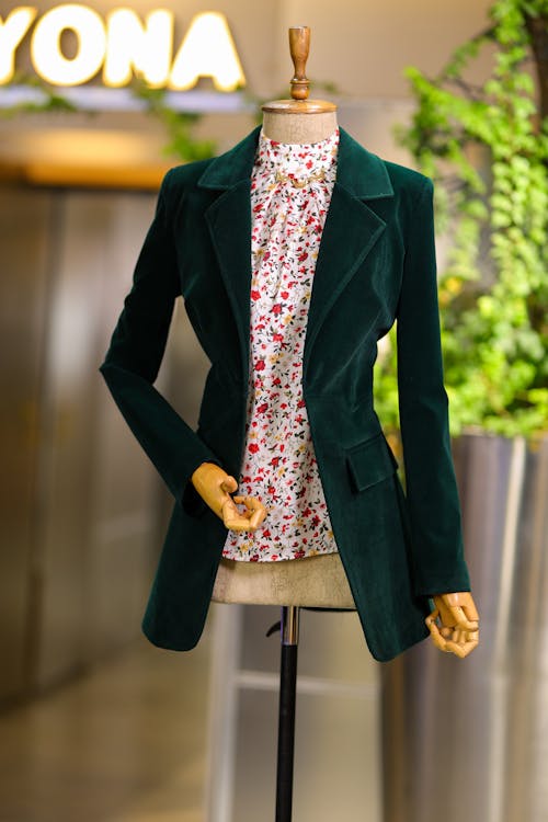 Green Jacket and Floral Blouse on a Mannequin