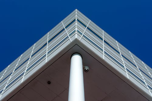 Low Angle Shot of a Modern Building under Blue Sky 