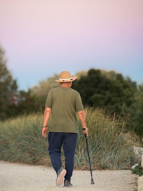 Man Walking in Hat and T-shirt