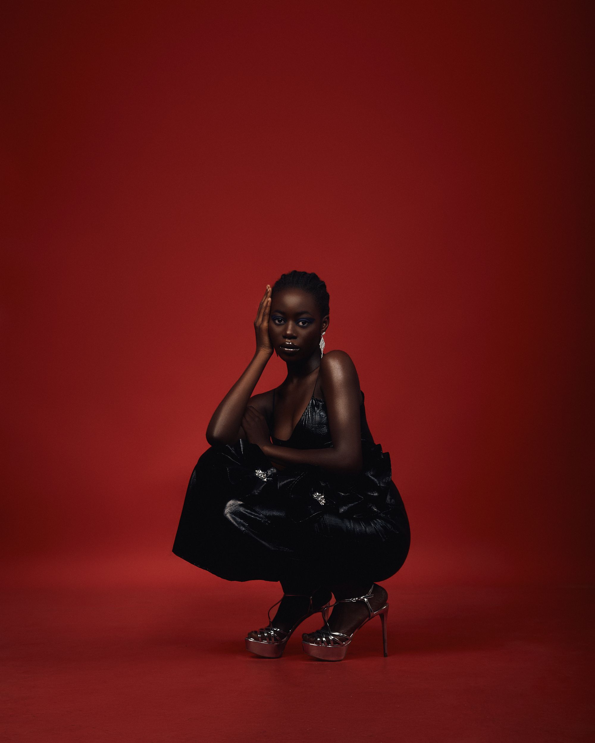 woman-squatting-in-black-dress-free-stock-photo