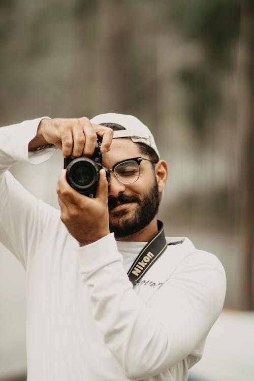 Portrait of a Photographer Taking Photos with a Nikon Camera