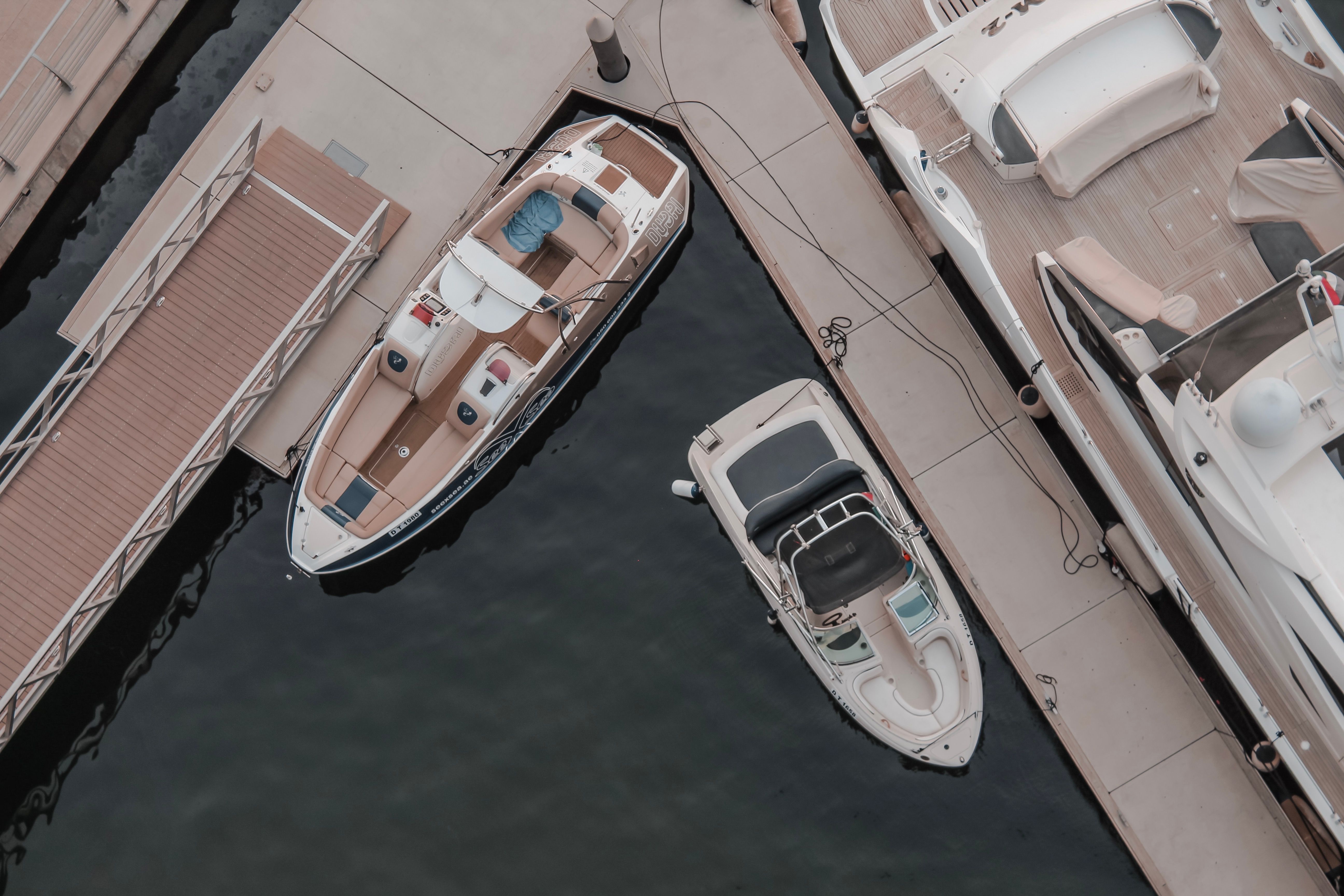A top-down view of boats docked in Dubai Marina, showcasing a peaceful harbor scene.