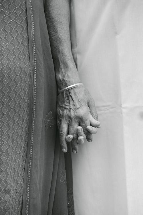 Close up of Couple Holding Hands in Black and White