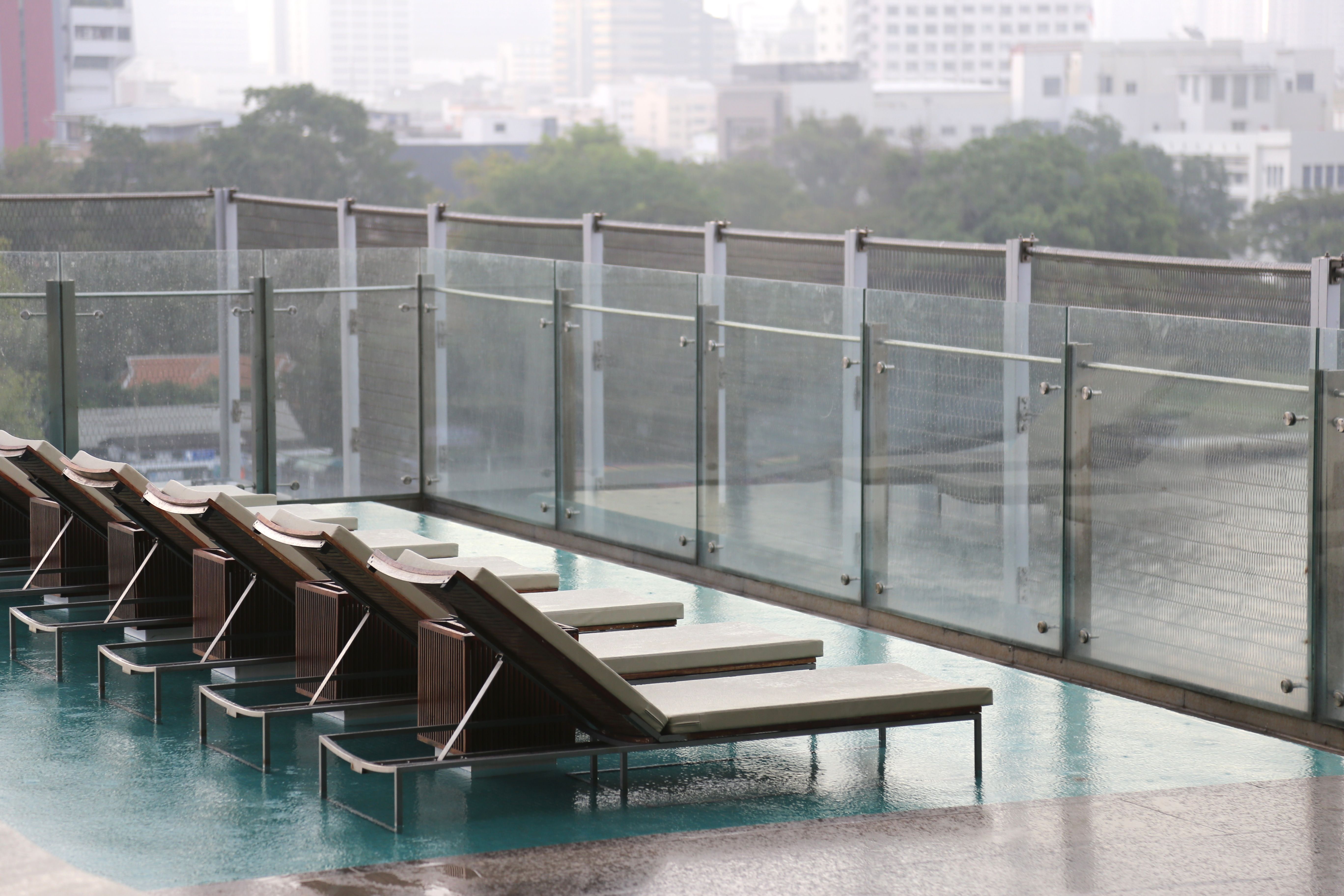 luxury rooftop terrace with pool and lounge seating