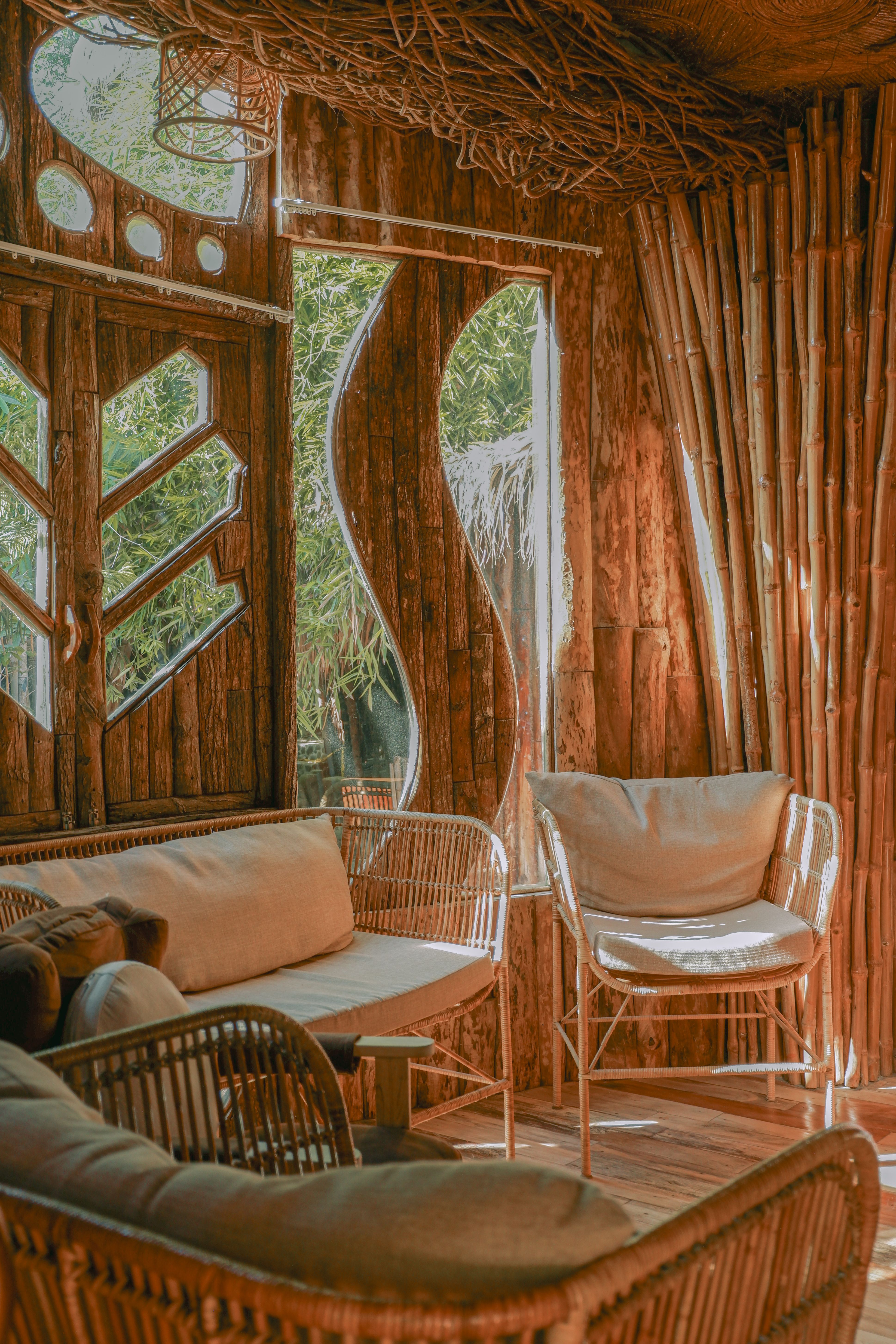Eco-luxury suite built from reclaimed and recycled materials at a coastal resort in Seminyak, Bali