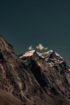 Stunning view of snow-capped peaks under a clear sky in Kaza, Himachal Pradesh.