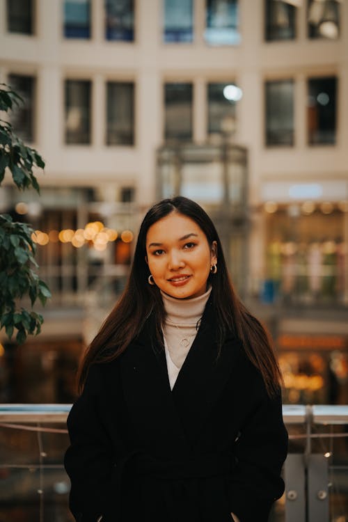 Smiling Woman in Black Coat