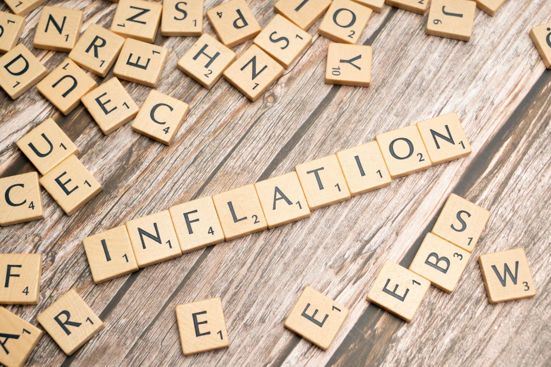 The word inflation is spelled out in scrabble letters