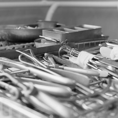 Pile of Steel Medical Tools and Containers