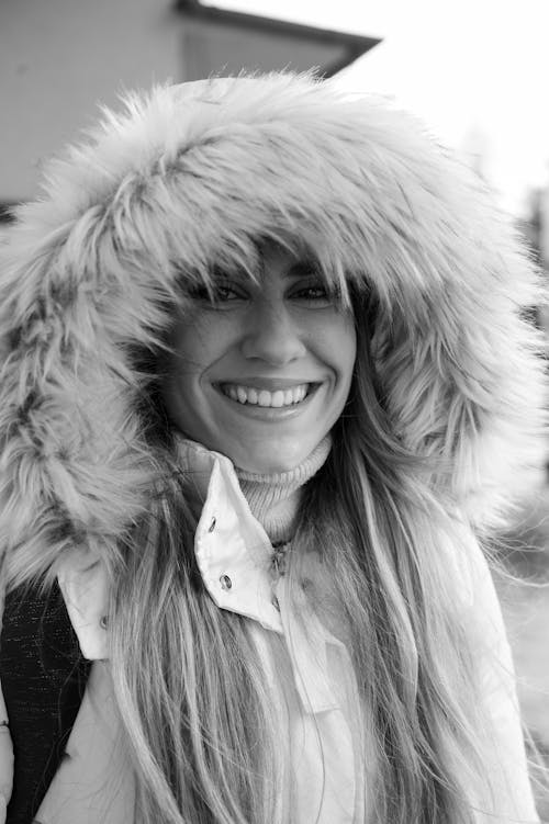 Smiling Woman in Coat with Fur Hood