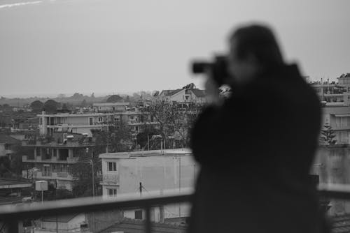 Man Photographing City
