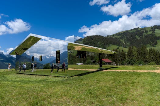 Mirrored installation in Saanen, Switzerland reflecting alpine scenery.