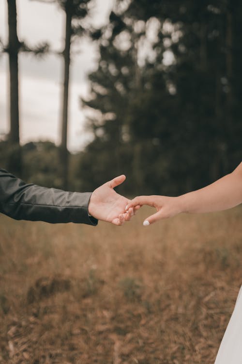 Man and Woman Holding Hands