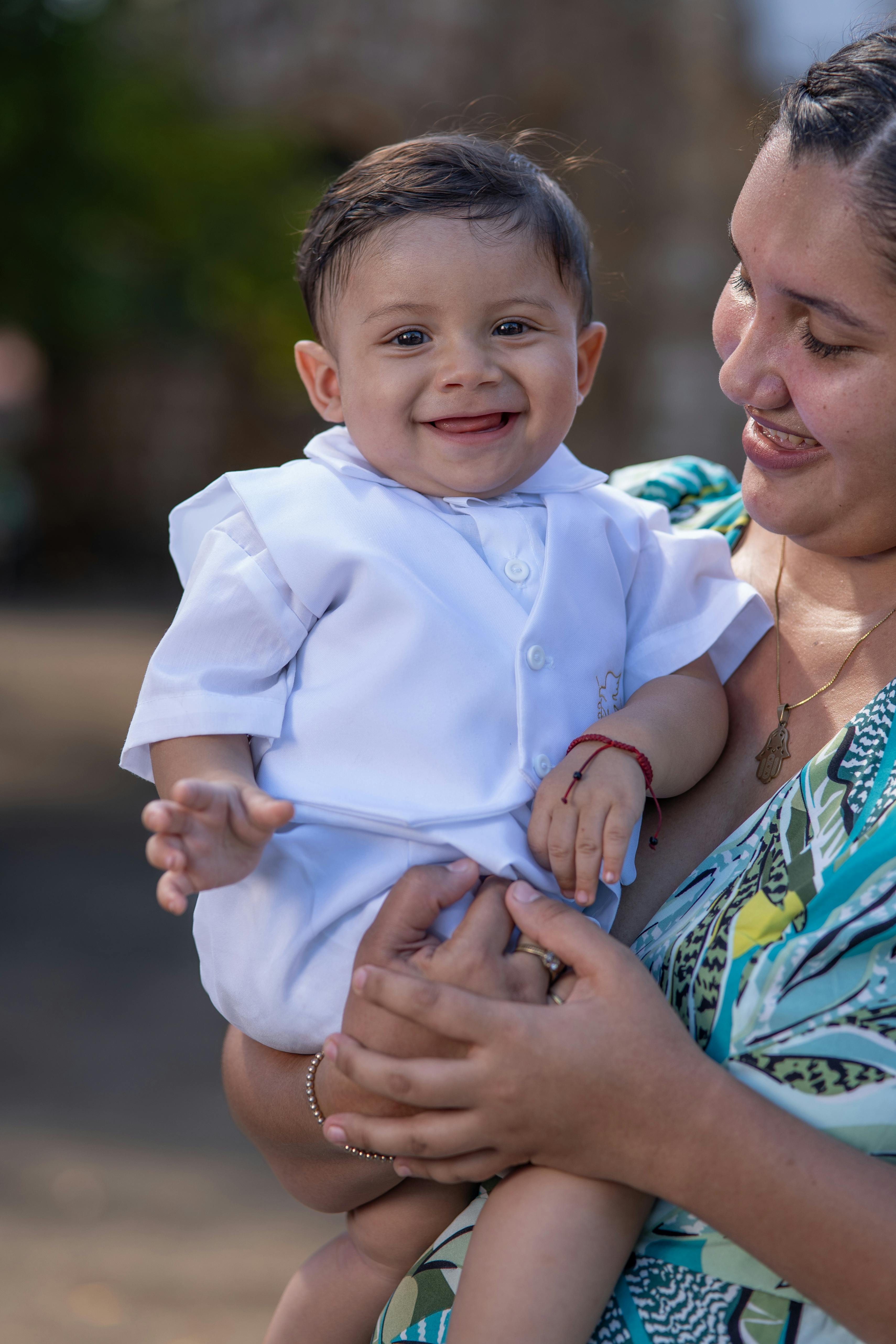 Woman Holding Happy Boy Free Stock Photo woman-holding-happy-boy-free-stock-photo