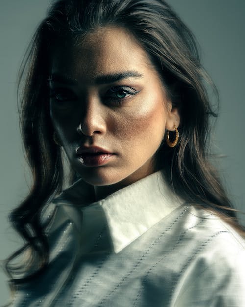 Model Wearing Makeup in Elegant Blouse