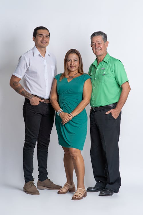 Free Three people standing in front of a white background Stock Photo