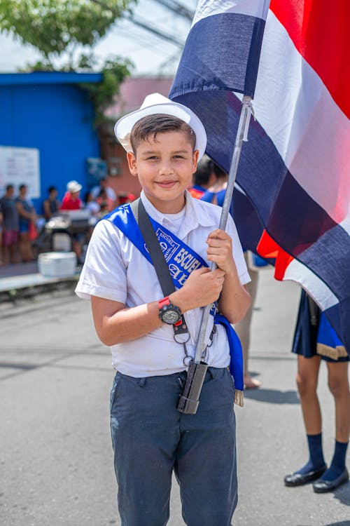 Boy in White Hat Holding Flag of Costa Rica