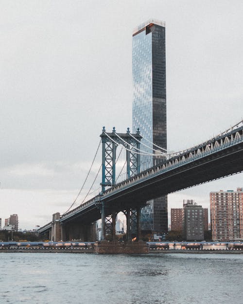 View of the Manhattan Bridge and One Manhattan Square Skyscraper in New York City 