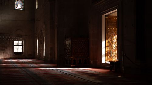 Free An ornate mosque doorway glowing with sunlight, showcasing architectural beauty. Stock Photo