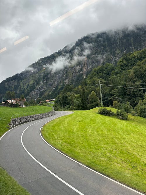 Asphalt Road in Countryside in Mountains Landscape