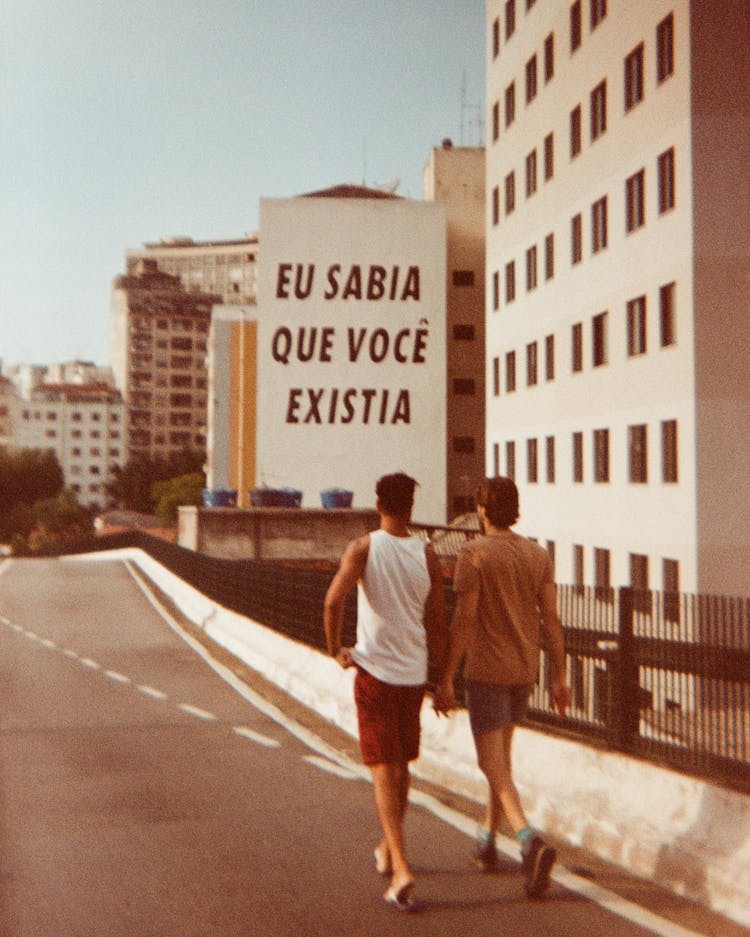 Men Walking On City Street