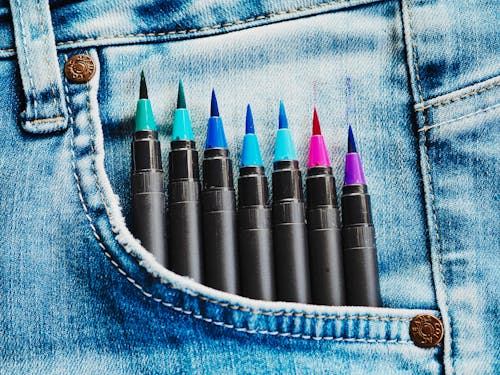 Close-up of Colorful Markers in jeans Pocket
