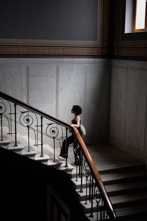 Free Woman Walking Up the Stairs Stock Photo