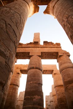 Majestic columns of Luxor Temple showcasing ancient Egyptian architecture under a clear sky.