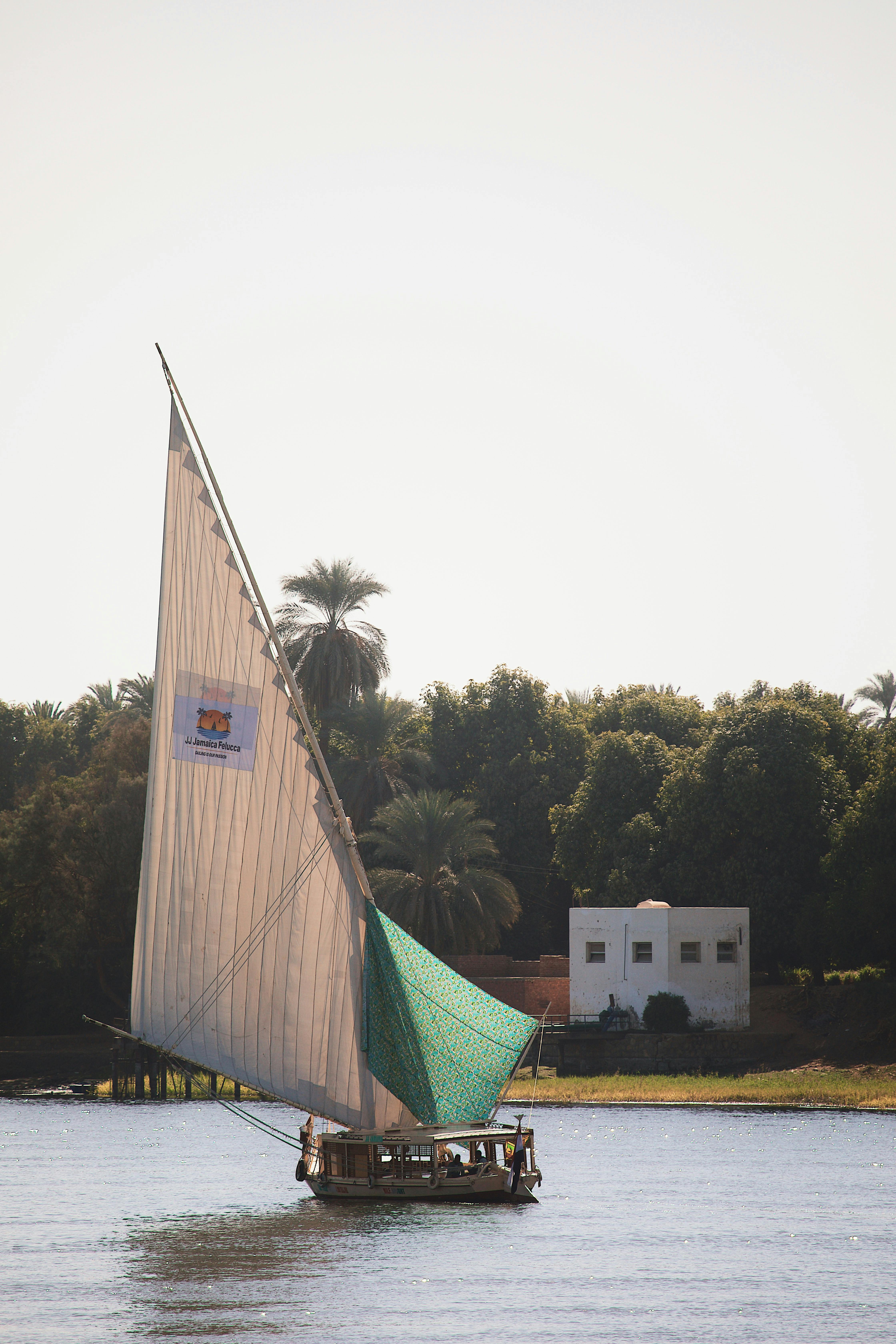 a sail boat is sailing on the water