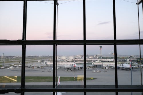 Airplanes behind Airport Windows