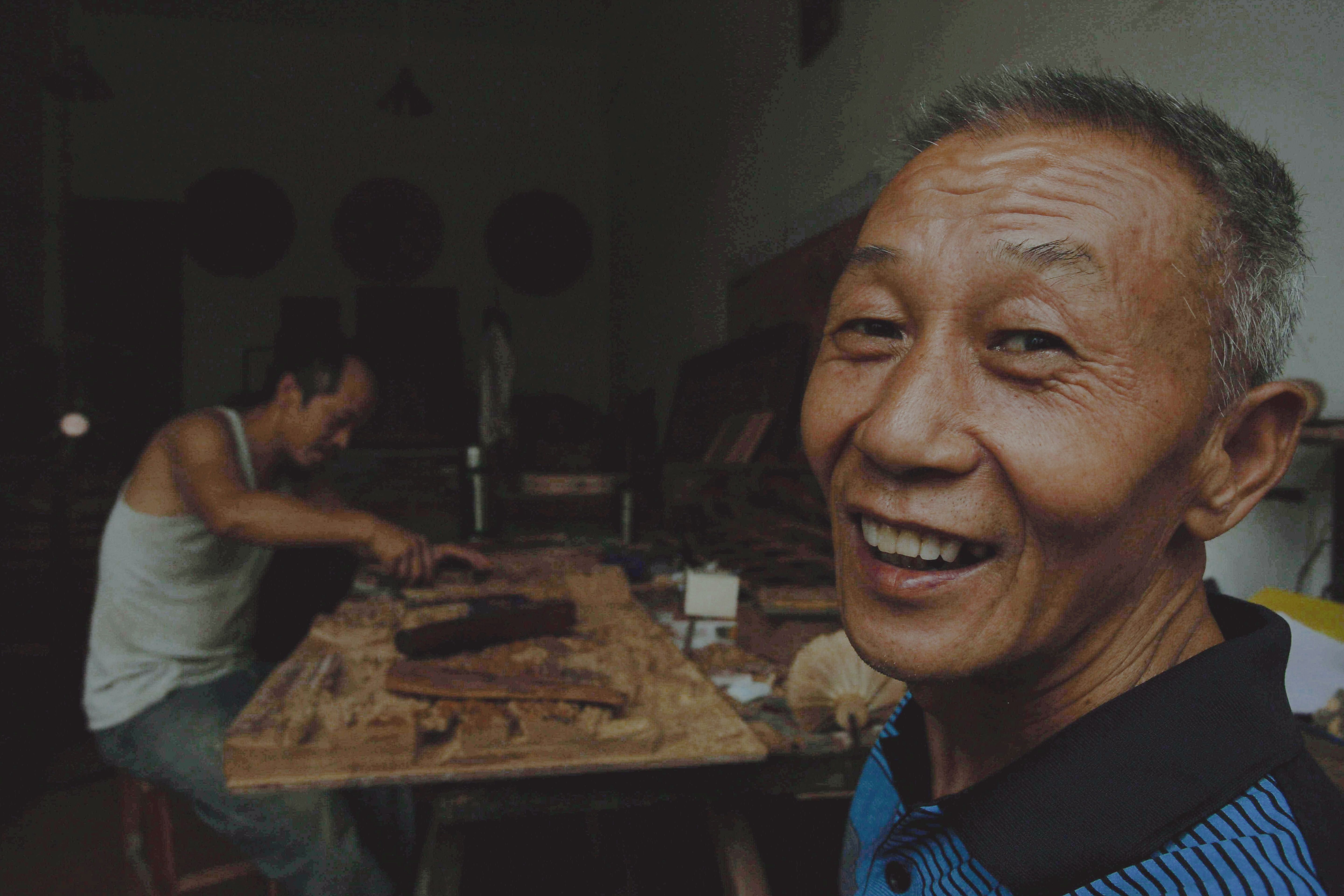 Smiling mature Asian man customer portrait