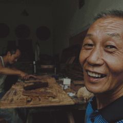 Smiling mature Asian man customer portrait