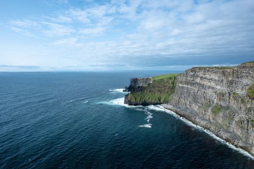 Free Stunning aerial capture of the Cliffs of Moher and the Atlantic Ocean in Ireland. Stock Photo