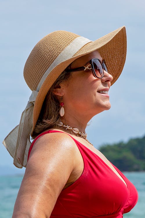Smiling Woman in Hat and Sunglasses in Summer