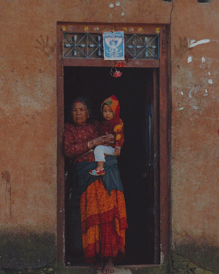 Grandma Standing With Grandchild