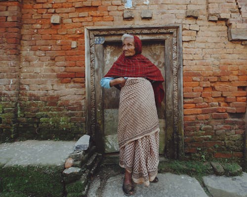 Elderly Woman in Shawl and Traditional Clothing