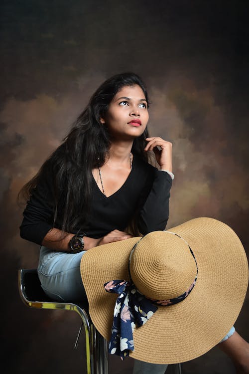 Beautiful Brunette Posing with Hat