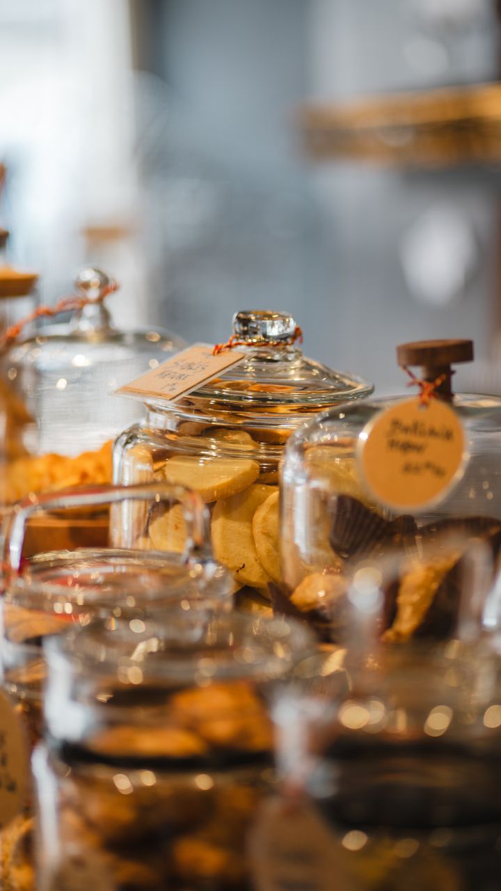 Clear labeled glass jar canisters for a dollar tree coffee bar design holding coffee beans and sugar