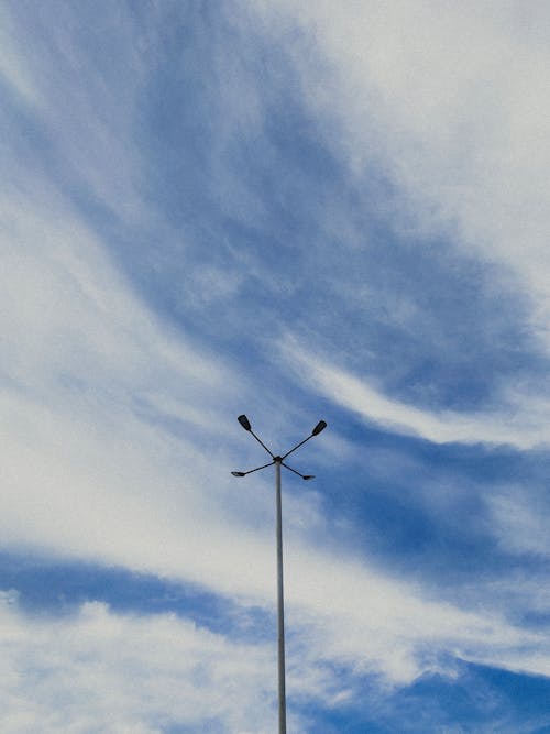 Lamppost against Cloudy Sky