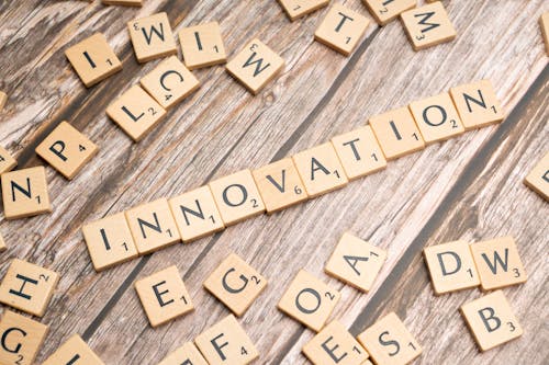 The word innovation spelled out in scrabble tiles